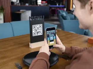 Waiter using tablet POS system